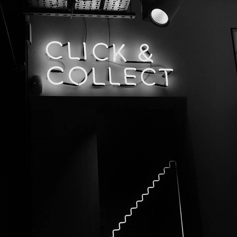 click & collect written in neon sign 