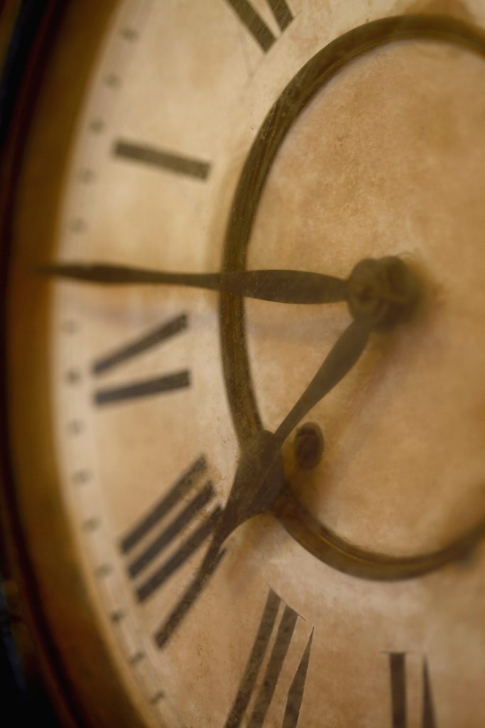 aged clock, only half the face 