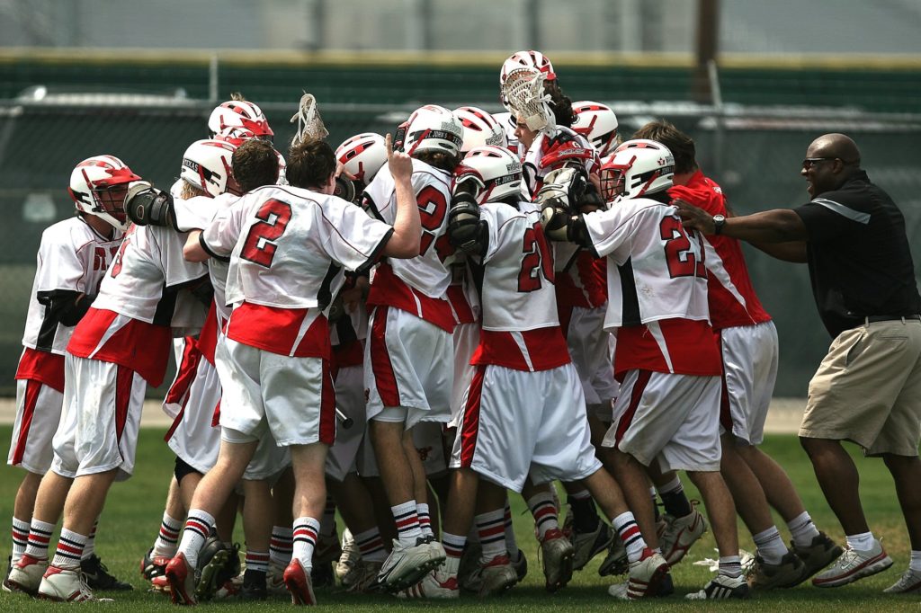 football team in huddle