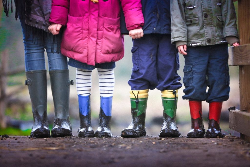 four children standing together