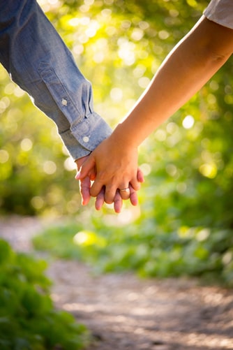 a man and woman holding hands