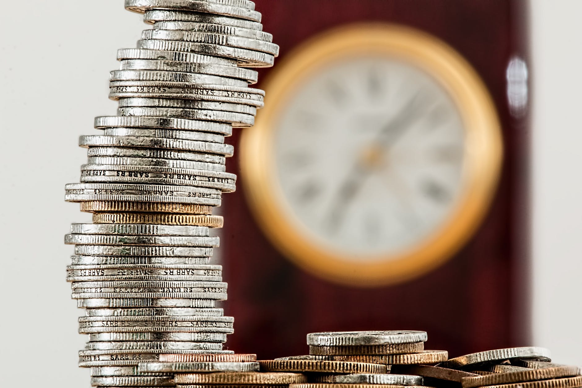 a stack of coins on a desk 