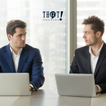 Listening To Customers Can Track Your Competitors | Two Boys Looking Intensely at Each Other While In Front Of Their Laptops