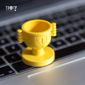 Organic SEO | A Mini Trophy With 1 Engraved on it Placed on Laptops Keyboard