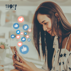 Use Social Media For Blogs | A Girl Holding Her Phone With Floating Icons Of Like And Heart Reactions For Facebook