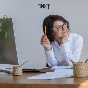 PPC Specialist | A Girl Looking At The Side Smiling In Front Of Her Desktop