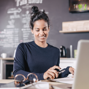 Online Reputation Final Insight | A Girl Smiling While Looking At Her Laptop