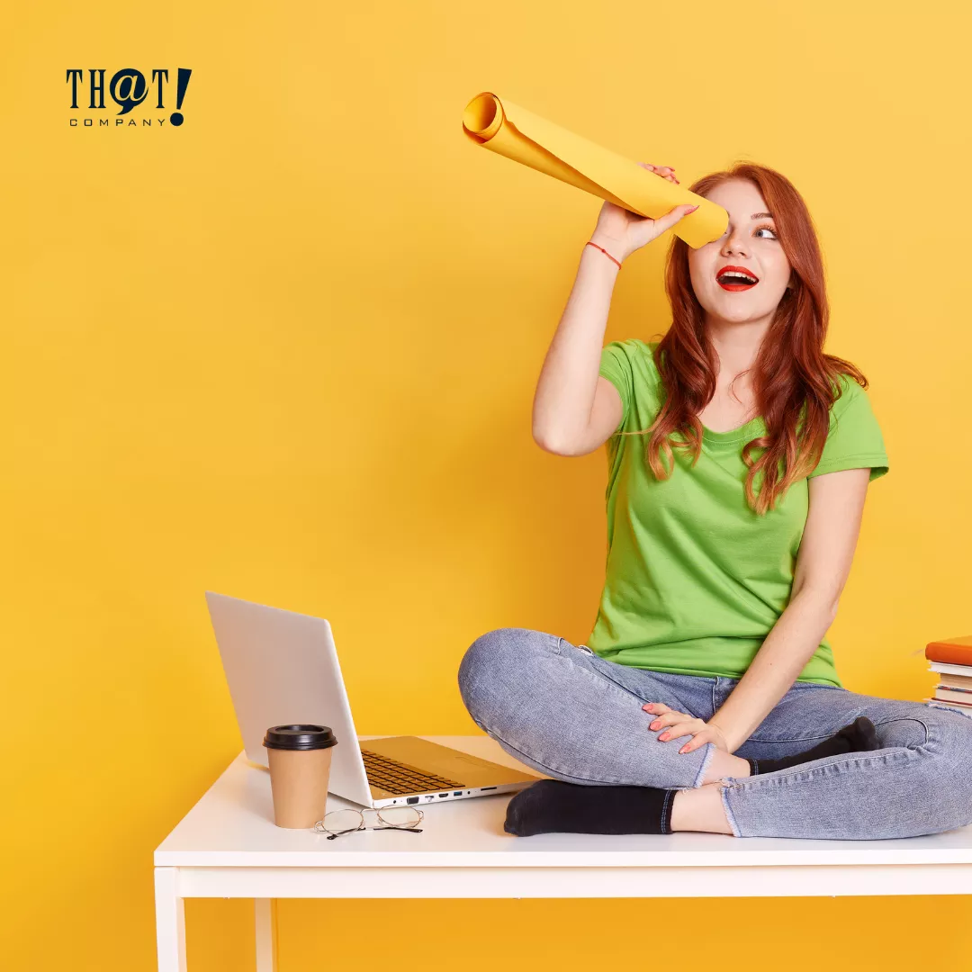 Audience Targeting | A Girl AT Top Of The Table Using Colored Paper As Telescope