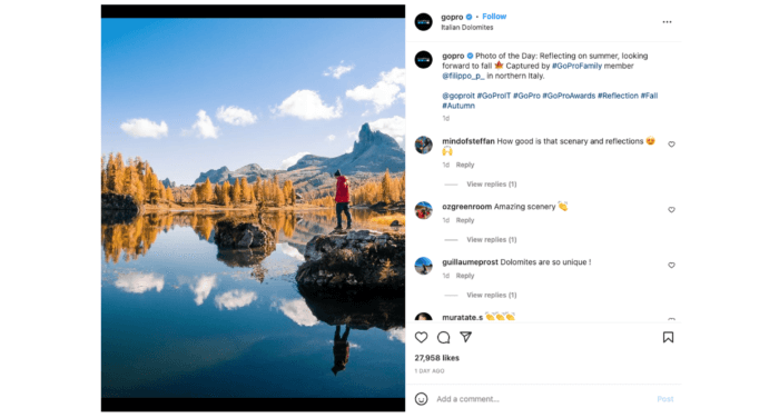 Postarea foto cu munți care se reflectă într-un lac de la GoPro este un bun exemplu de maximizare a acoperirii Instagram